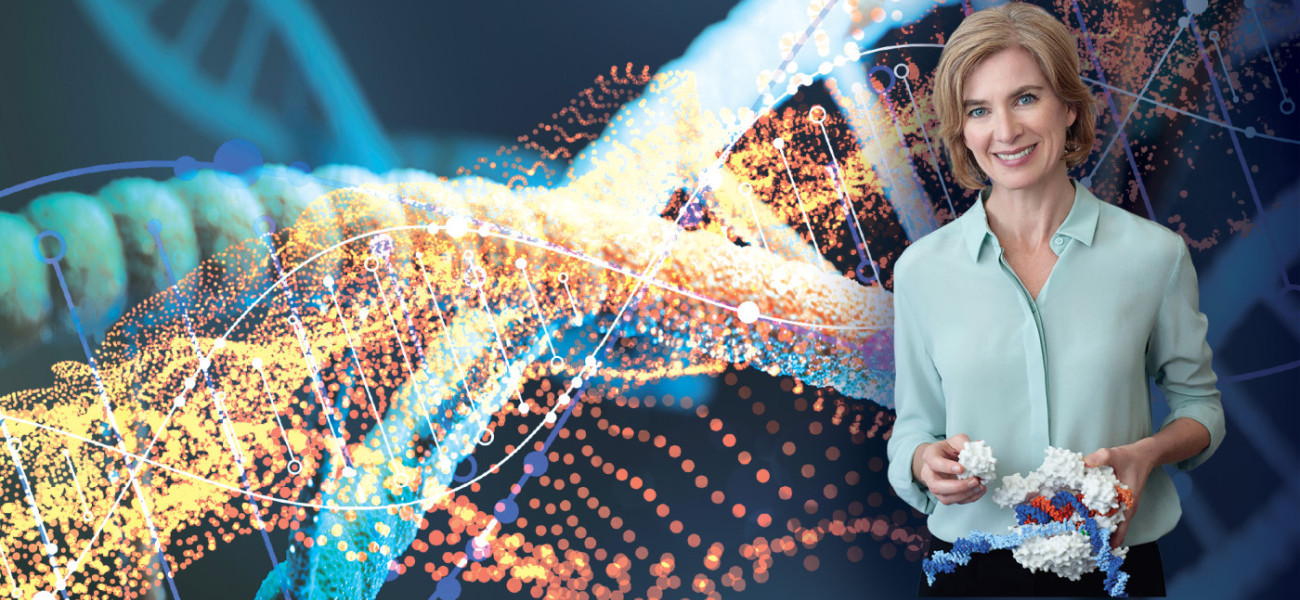 Jennifer Doudna holds a plastic molecule model with brightly lit DNA strands in the background.