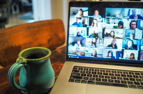 zoom meeting screen with coffee cup