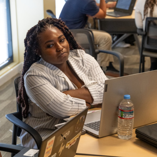 Hackathon candid of woman and laptop