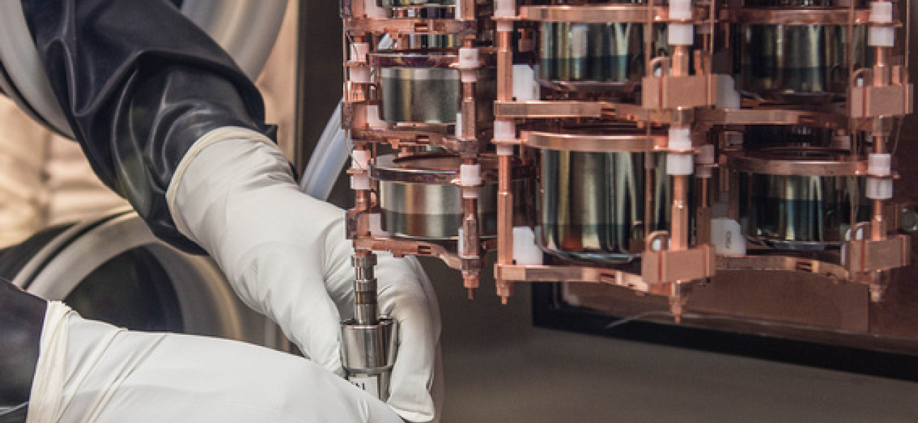 Gloved hands manipulate electronics