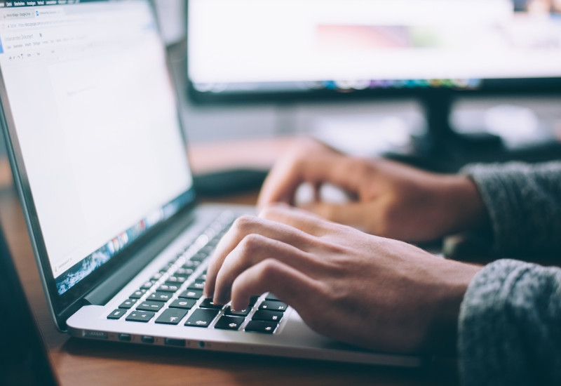hands on a laptop keyboard
