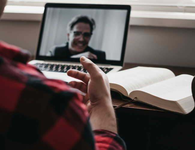 two people confer in remote conference